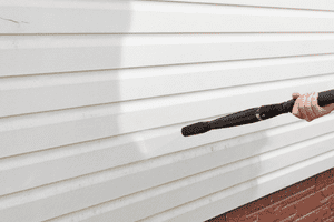 pressure-washing-siding-on-house